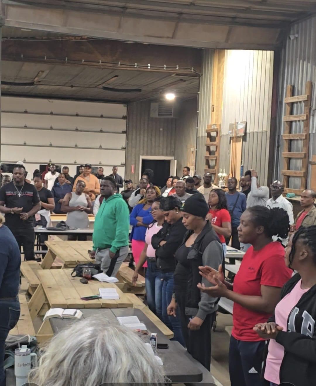 Community gathered for a worship and music evening in a barn