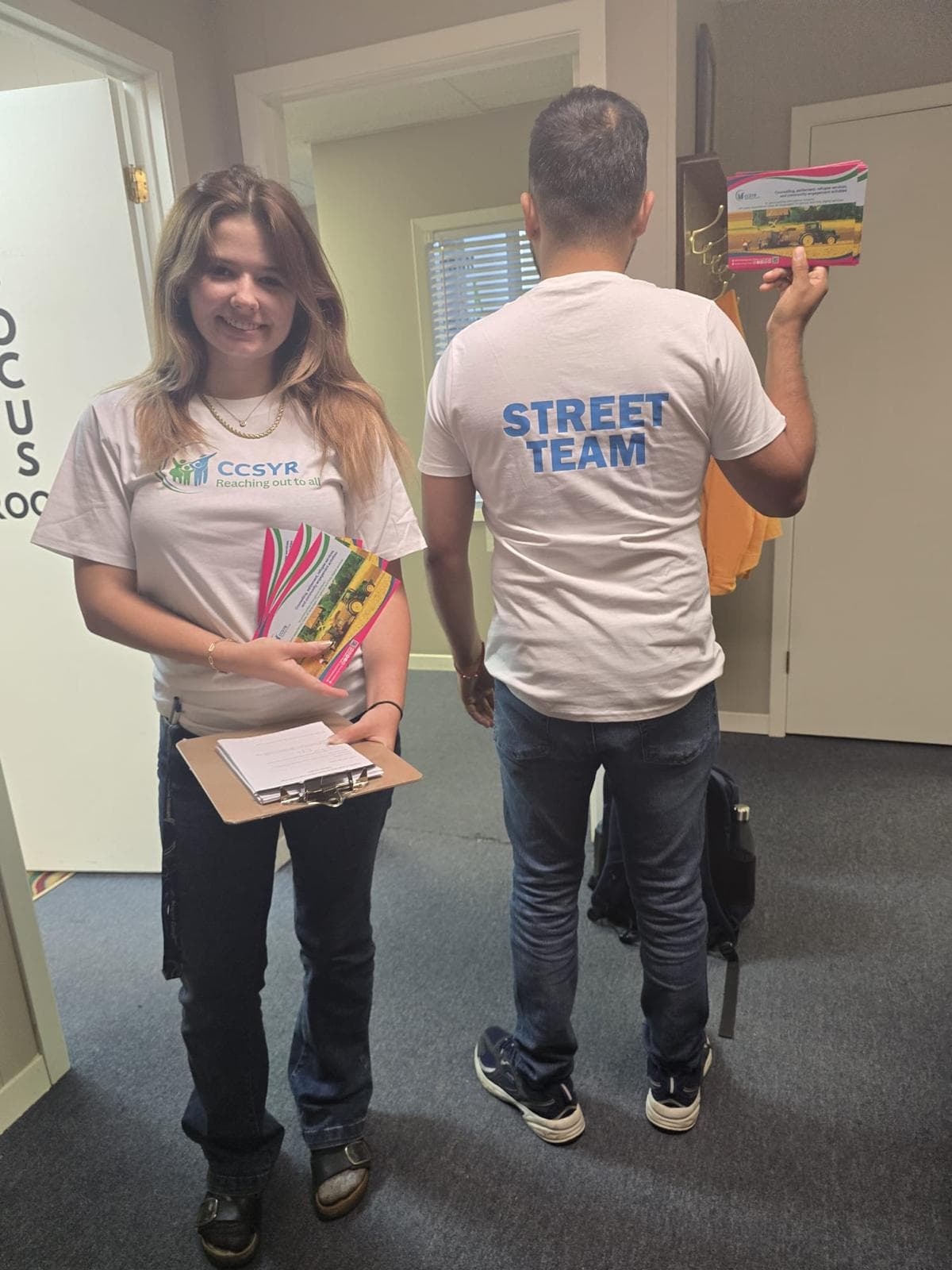 Man in a green cap showing off his handmade bracelet