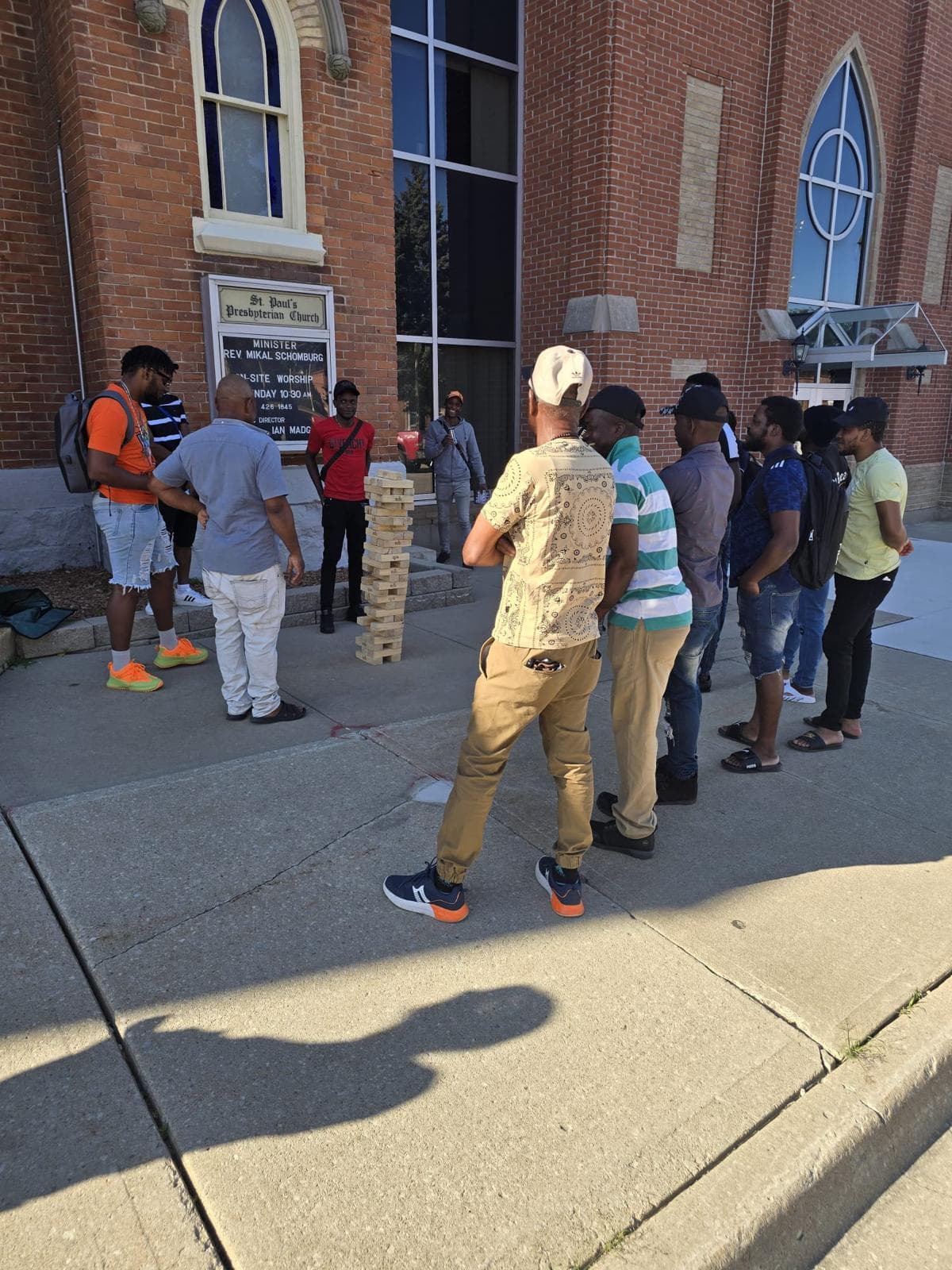 Wide view of the giant Jenga game at a summer community event