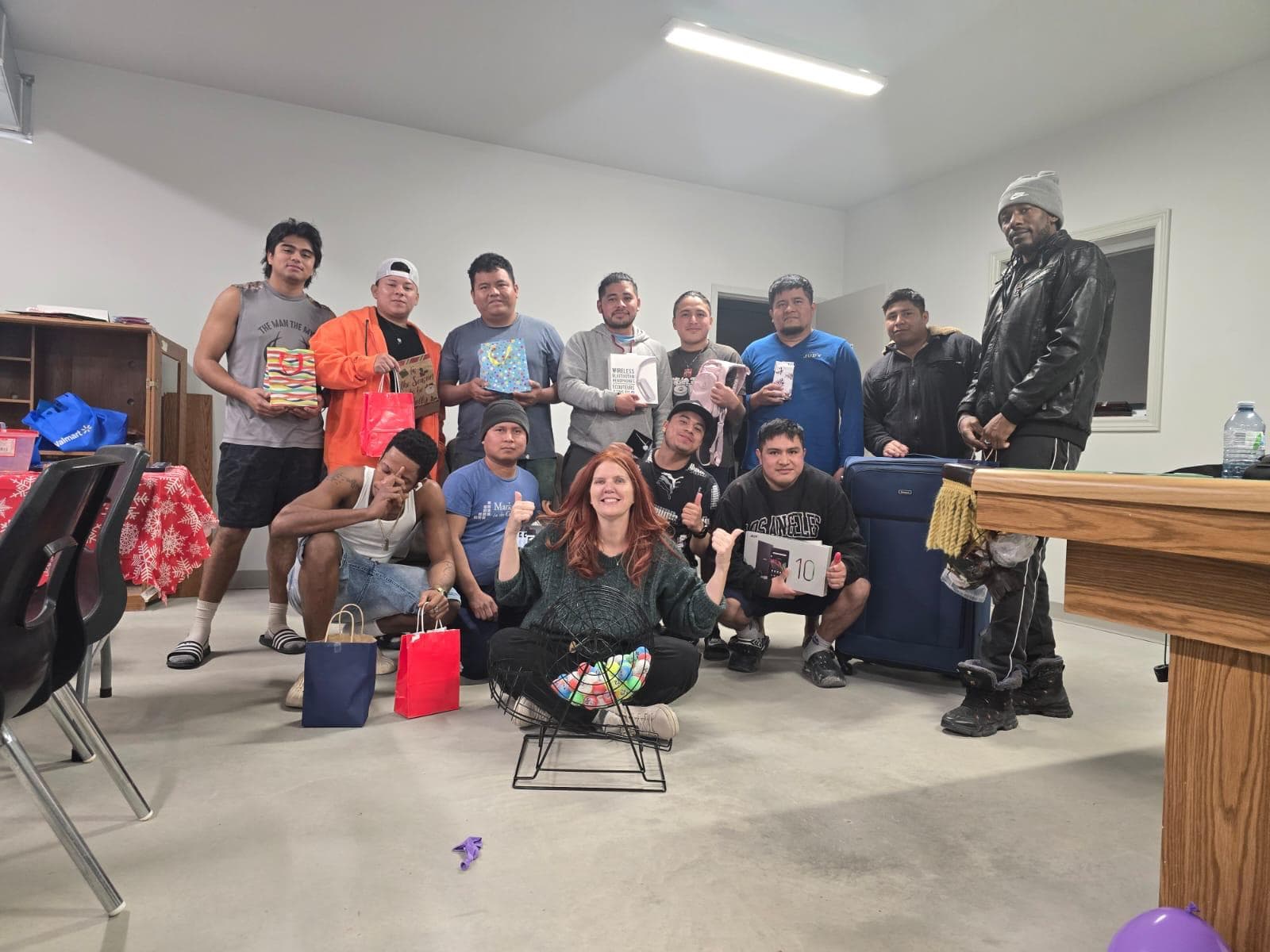 Farm workers receiving holiday gifts at a seasonal celebration